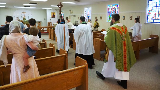Clergy and parishioners processing down the aisle